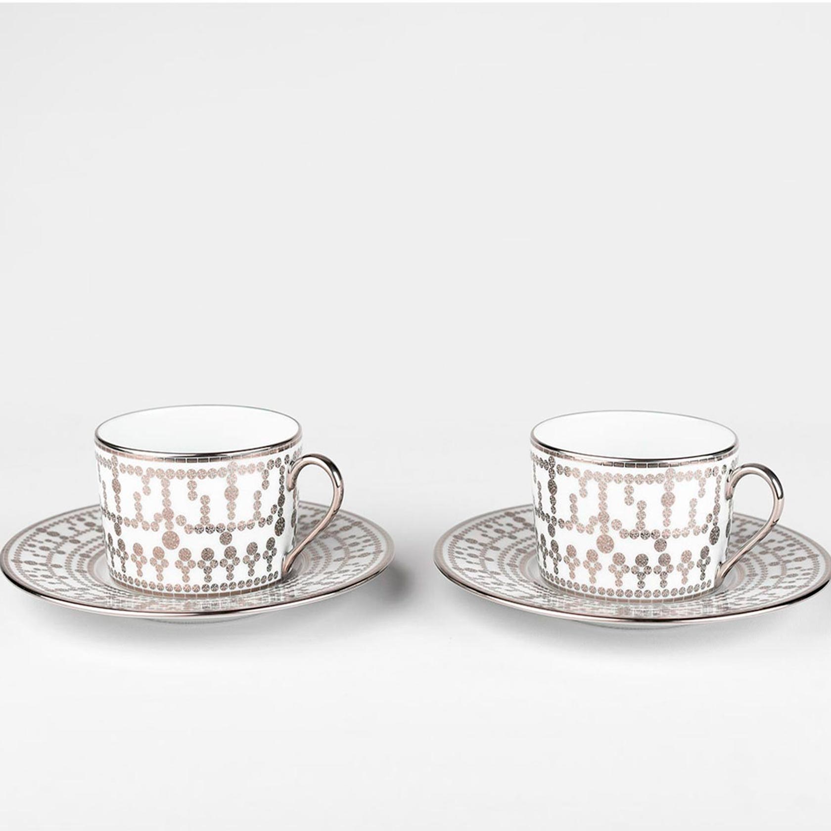 Set of 2 tea cups and saucers