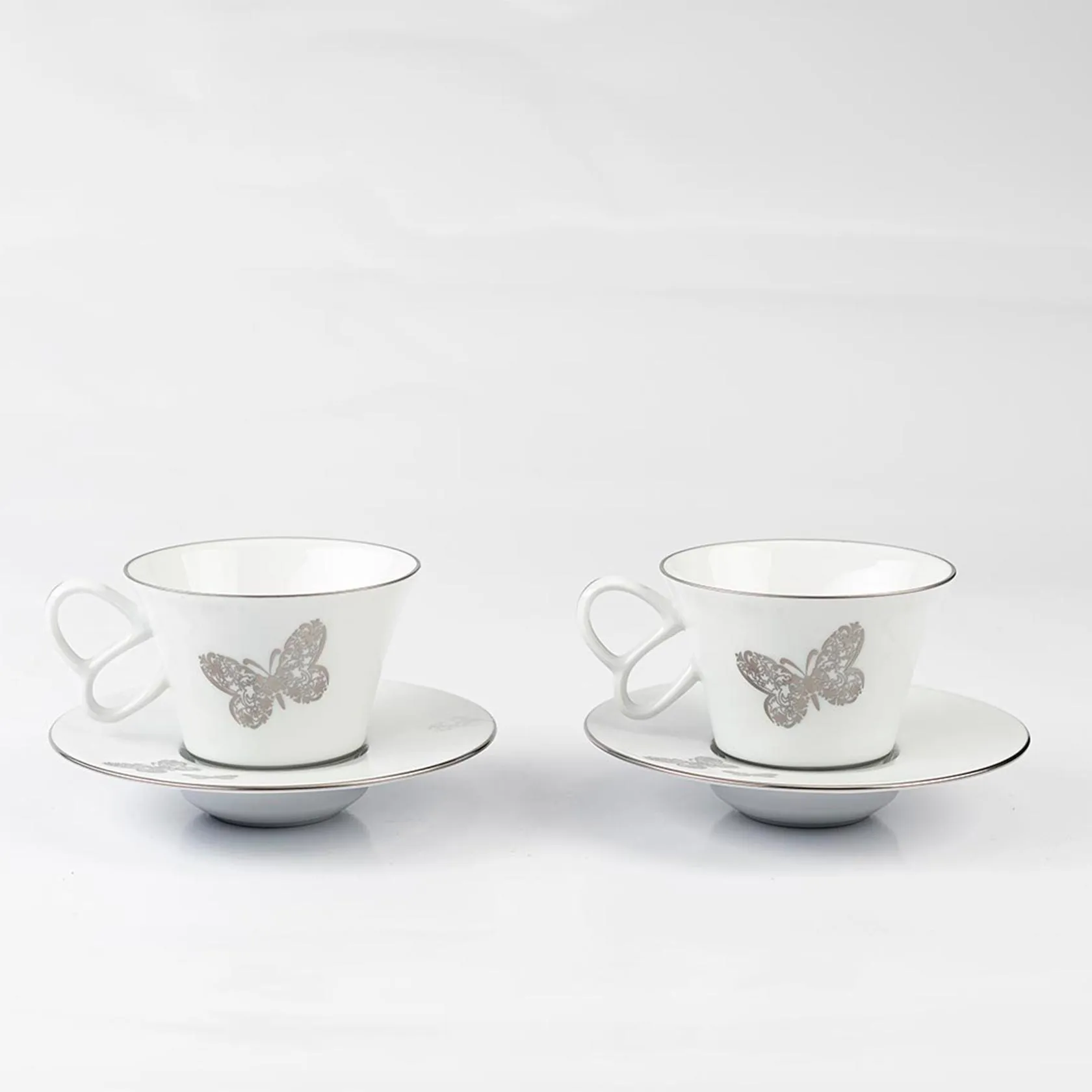 Set of 2 tea cups and saucers